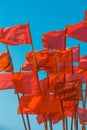 Red flags flying in wind Royalty Free Stock Photo