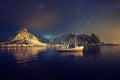 fishing boat and Reine Village, Lofoten Islands