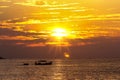 The fishing boat returned under Bright sunrise on the beach in Nha Trang City - Vietnam