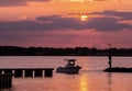 Fishing boat returning home at sunset Royalty Free Stock Photo