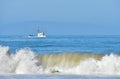 Fishing boat returning to the harbor. Royalty Free Stock Photo