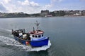 Fishing boat returning to harbour in Scarborough Royalty Free Stock Photo