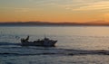 The fishing boat returns to the port after a working day Royalty Free Stock Photo