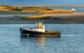 Fishing boat on a river in Cape Cod on a sunny day in Massachusetts Royalty Free Stock Photo