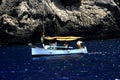 Fishing boat and rocky coast