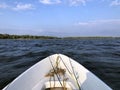 fishing boat with a fishing rod in the foreground Royalty Free Stock Photo