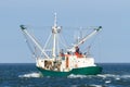 Fishing boat sailing out on the ocean the catch some fish on the North Sea Royalty Free Stock Photo