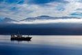 Fishing boat sailing into the port of Neskaupstadur in the fjord of North Iceland Royalty Free Stock Photo