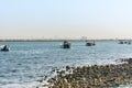 Fishing boat sailing at the sea in the corniche park, the city of Dammam, Kingdom of Saudi Arabia Royalty Free Stock Photo