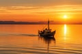 fishing boat sailing towards the horizon in golden hour Royalty Free Stock Photo