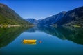 Fishing boat sailing on water with mountains in Norway. Royalty Free Stock Photo