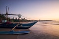 Fishing boat on sand beach at colorful dawn Royalty Free Stock Photo
