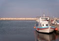 A fishing boat in a sea bay. sunset Royalty Free Stock Photo