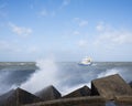 Fishing boat at sea near harbor of scheveningen in holland in stormy weather