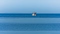 Fishing boat at sea on a sunny morning in Sithonia
