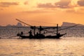 Fishing boat silouhette at sunset