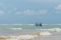 Fishing boat in a storm approaching Royalty Free Stock Photo