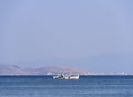 Fishing boat on a sunny afternoon on the calm Aegean Sea on the island of Evia, Greece