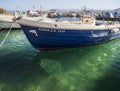 Fishing boat on a sunny afternoon on the calm Aegean Sea on the island of Evia, Greece