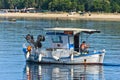 Fishing boat at sunny morning in front of Destenika beach