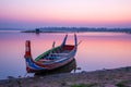 Fishing boat in sunrise at U Bein bridge, Mandalay, Myanmar Royalty Free Stock Photo