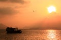 Fishing boat in sunset, Hong Kong. Royalty Free Stock Photo