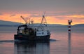 Fishing boat at sunset, Oban Bay, Scotland. Royalty Free Stock Photo