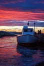 Fishing boat at sunset time. Sunset lake boat silhouette view. Burgas Bay. Bulgaria. Royalty Free Stock Photo