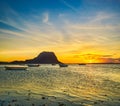 Fishing boat at sunset time. Le Morn Brabant on background. Royalty Free Stock Photo