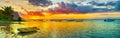 Fishing boat at sunset time. Le Morn Brabant on background. Panorama landscape Royalty Free Stock Photo