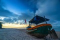 Fishing boat to dawn on the beautiful beach Royalty Free Stock Photo