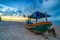 Fishing boat to dawn on the beautiful beach Royalty Free Stock Photo