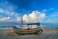 Fishing boat to dawn on the beautiful beach Royalty Free Stock Photo