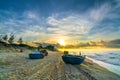 Fishing boat to dawn on the beautiful beach Royalty Free Stock Photo