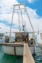 Fishing boat with a trawl in the port of the Adriatic sea