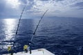 Fishing boat trolling with two rods and reels Royalty Free Stock Photo