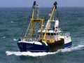 Fishing Boat Underway to Harbour. Royalty Free Stock Photo