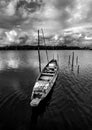 Fishing boat with view of landscape nature in sky and cloud storm and river in rain season, Black and white and monochrome style Royalty Free Stock Photo