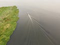 A fishing boat was sailing in a large lagoon