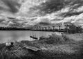 Fishing boat and water barrier and river with cloud sky storm, Black and white and monochrome style Royalty Free Stock Photo