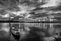 Fishing boat and water barrier and river with cloud sky storm in rain season Royalty Free Stock Photo