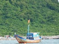 Fishing boat and house on the water