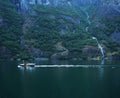 Fishing boat and waterfall