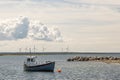 Fishing Boat by Wind Power Stations. Royalty Free Stock Photo