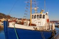 Fishing boat with a wooden mast