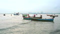 Fishing boats abstain from catching fish at sea cause storm and low tide