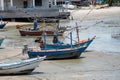 Fishing boats aground on the beach over cloudy sky at Prachuap K Royalty Free Stock Photo