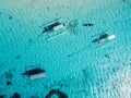 Fishing boats at anchor in blue sea in tropical island. Aerial view Royalty Free Stock Photo