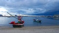 Fishing boats anchored by the beach while a storm is approaching, Prachuap Khiri Khan, Thailand Royalty Free Stock Photo