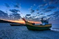 Fishing boats on the Baltic Sea beach in Jantar at sunset. Poland Royalty Free Stock Photo